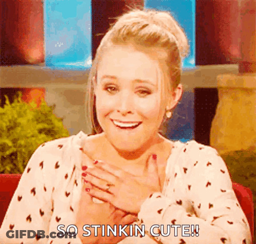 A Woman Is Smiling With Her Hands On Her Chest And Says So Stinkin Cute . GIF
