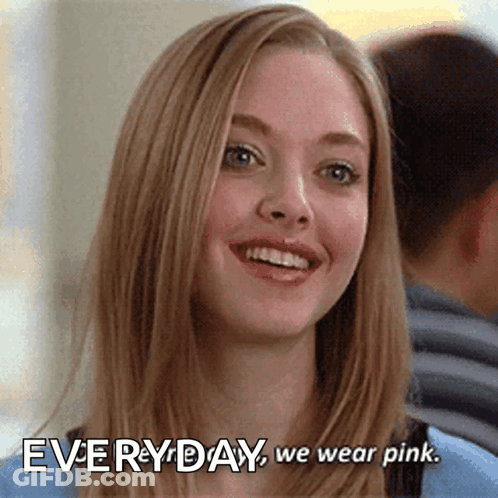 A Woman Is Smiling With The Words " Everyday We Wear Pink " Above Her GIF