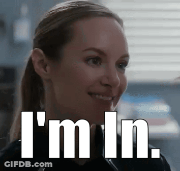 A Woman Is Smiling With The Words I 'M In Written Below Her GIF