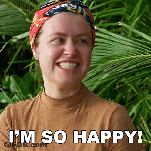 A Woman Is Smiling With The Words I 'M So Happy Written Below Her GIF