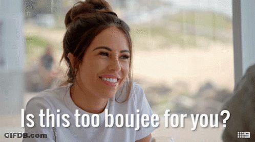 A Woman Is Smiling With The Words " Is This Too Boujee For You " GIF