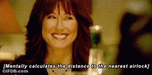 A Woman Is Smiling With The Words Mentally Calculates The Distance To The Nearest Airlock Below Her GIF