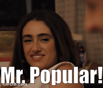 A Woman Is Smiling With The Words " Mr. Popular " Above Her GIF