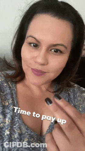 A Woman Is Smiling With The Words Time To Pay Up On Her Chest GIF