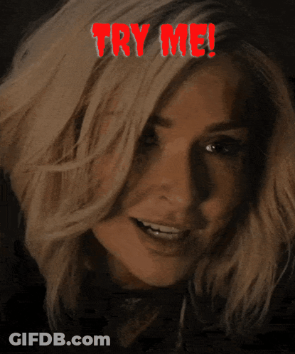 A Woman Is Smiling With The Words Try Me Above Her Head GIF