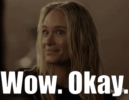 A Woman Is Smiling With The Words Wow Okay Written Below Her GIF