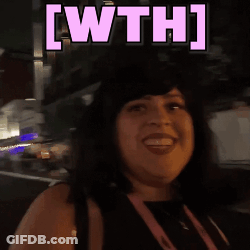 A Woman Is Smiling With The Words [ Wth ] Above Her GIF