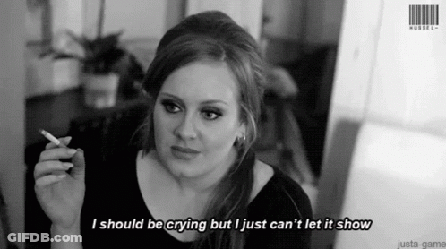 A Woman Is Smoking A Cigarette And Says I Should Be Crying But I Just Can 'T Let It Show . GIF