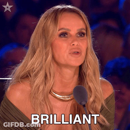 A Woman Is Speaking Into A Microphone And The Word Brilliant Is On The Screen Behind Her GIF