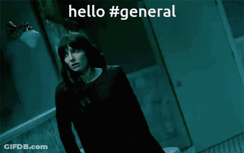 A Woman Is Standing In A Dark Room With The Words Hello #General Written Above Her GIF