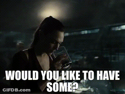 A Woman Is Standing In A Dark Room With The Words `` Would You Like To Have Some '' Written Above Her . GIF
