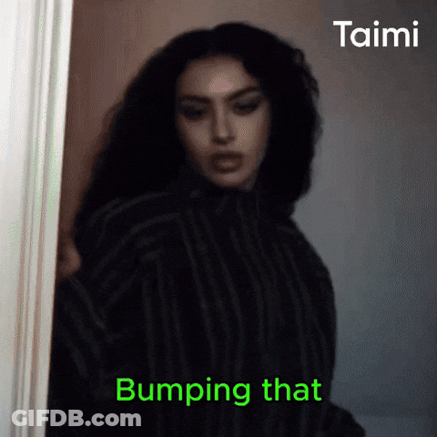 A Woman Is Standing In A Doorway With The Words Bumping That On The Bottom Right GIF