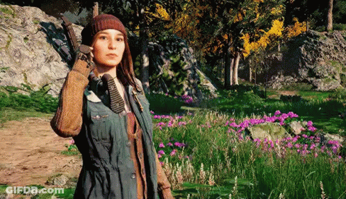 A Woman Is Standing In A Field Of Flowers In A Video Game Holding A Gun . GIF