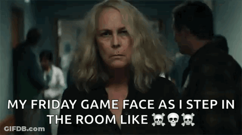 A Woman Is Standing In A Hallway With A Skull And Crossbones On Her Shirt . GIF
