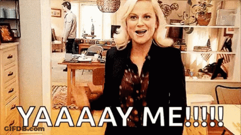 A Woman Is Standing In A Living Room With A Man Standing Behind Her And A Man Standing In The Background . GIF