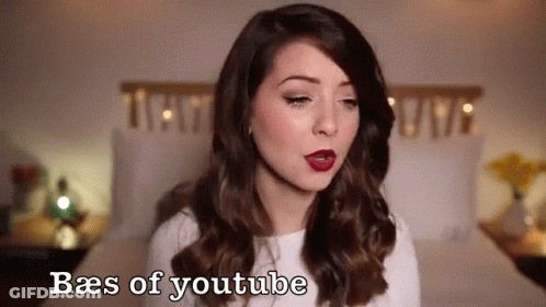 Woman Standing In Front Of Bed With Baes Of YouTube GIF