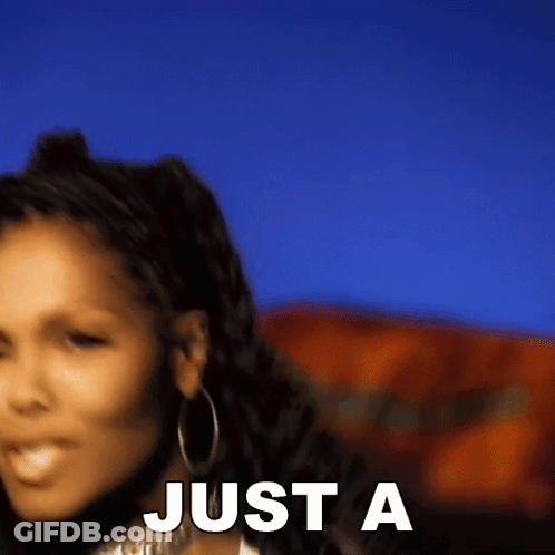 A Woman Is Standing In Front Of A Blue Sky With The Words `` Just A '' Written On The Bottom . GIF