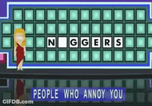 A Woman Is Standing In Front Of A Board That Says Niggers GIF