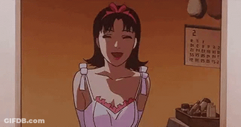 A Woman Is Standing In Front Of A Calendar In A Room . GIF