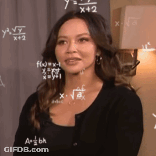 A Woman Is Standing In Front Of A Chalkboard With Mathematical Equations On It GIF