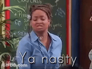A Woman Is Standing In Front Of A Chalkboard With The Words Ya Nasty Written On It GIF