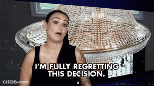 A Woman Is Standing In Front Of A Chandelier And Saying I 'M Fully Regretting This Decision GIF