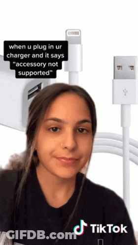 A Woman Is Standing In Front Of A Charger That Says Accessory Not Supported On It GIF