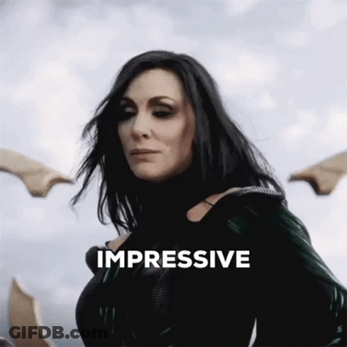 A Woman Is Standing In Front Of A Cloudy Sky And The Word Impressive Is Above Her GIF