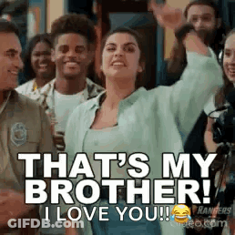 A Woman Is Standing In Front Of A Crowd Of People And Saying `` That 'S My Brother , I Love You ! '' GIF