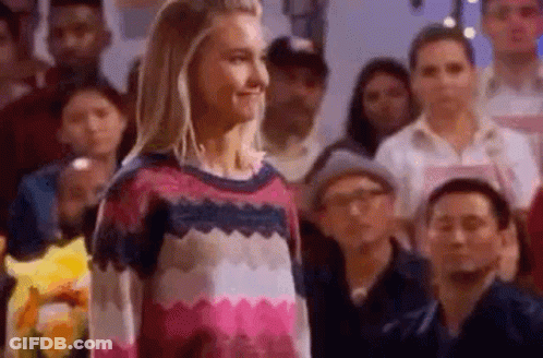 Woman Standing In Front Of Crowd GIF