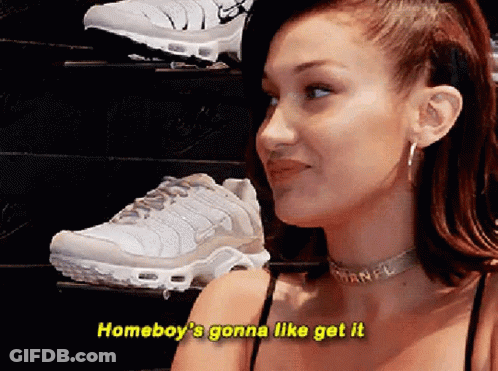 A Woman Is Standing In Front Of A Display Of Shoes And Says " Homeboy 'S Gonna Like Get It " . GIF