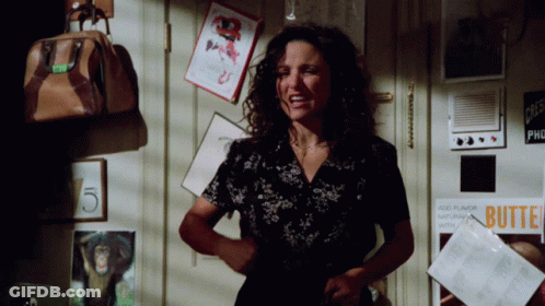 A Woman Is Standing In Front Of A Door With A Sign That Says Butte GIF