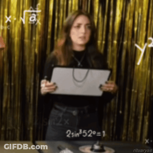 A Woman Is Standing In Front Of A Gold Curtain Holding A Piece Of Paper That Says 2 Sin 52 = 1 GIF