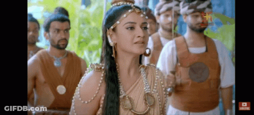Woman Standing In Front Of Men With Sword GIF