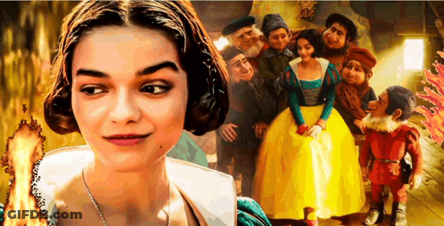 A Woman Is Standing In Front Of A Group Of People GIF