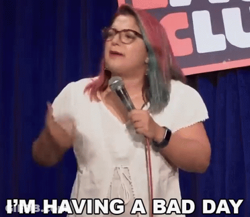 Woman Standing In Front Of Microphone Saying Bad Day GIF