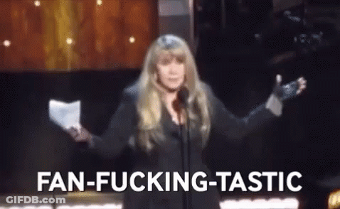 A Woman Is Standing In Front Of A Microphone Holding A Piece Of Paper And Talking Into It . GIF