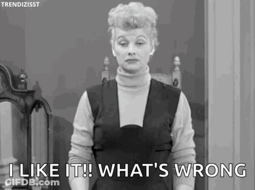A Woman Is Standing In Front Of A Mirror And Saying `` I Like It What 'S Wrong '' . GIF