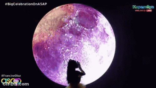 A Woman Is Standing In Front Of A Purple Full Moon With The Hashtag #Bigcelebration On Asap GIF