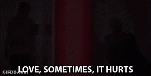 Woman Standing In Front Of Red Light Love Sometimes Hurts GIF