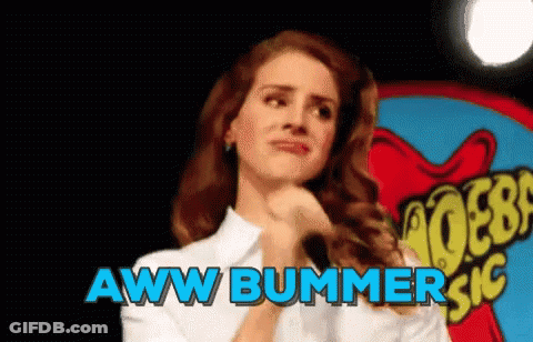 A Woman Is Standing In Front Of A Sign That Says Aww Bummer Sic GIF