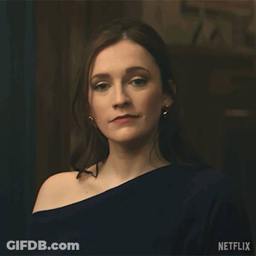 A Woman Is Standing In Front Of A Sign That Says " Done " GIF