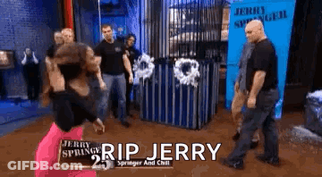 A Woman Is Standing In Front Of A Sign That Says Rip Jerry On It GIF