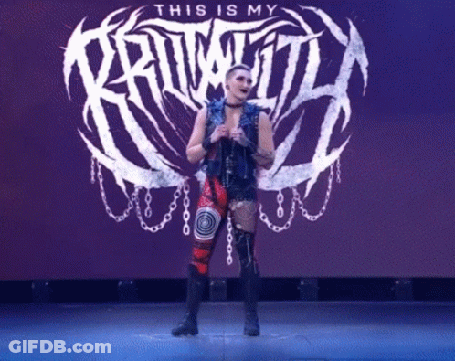 A Woman Is Standing In Front Of A Sign That Says " This Is My Kruwitt " GIF