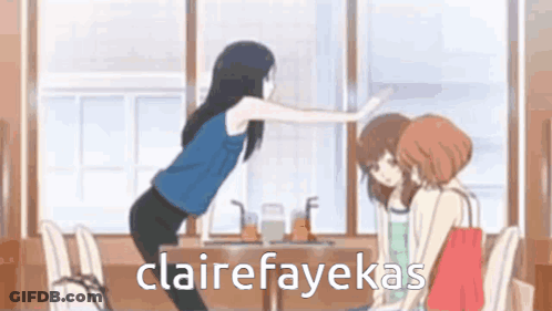 A Woman Is Standing In Front Of A Table With Two Other Women Sitting At It . GIF