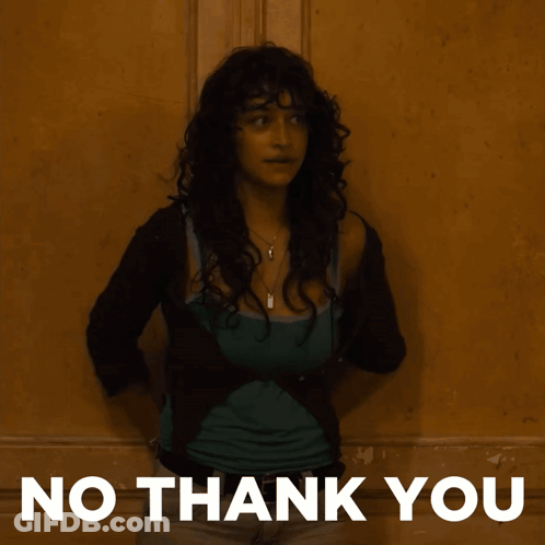 A Woman Is Standing In Front Of A Wall With The Words No Thank You On The Bottom GIF