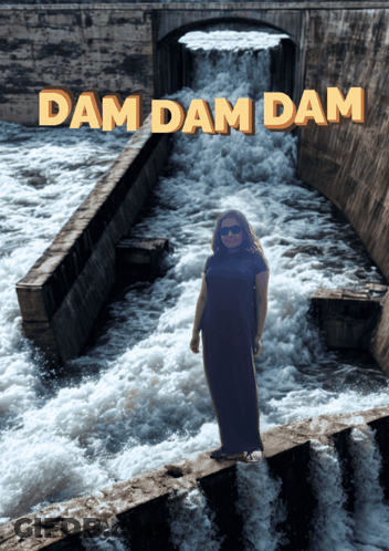 A Woman Is Standing In Front Of A Waterfall With The Words Dam Dam Dam Written Above Her GIF