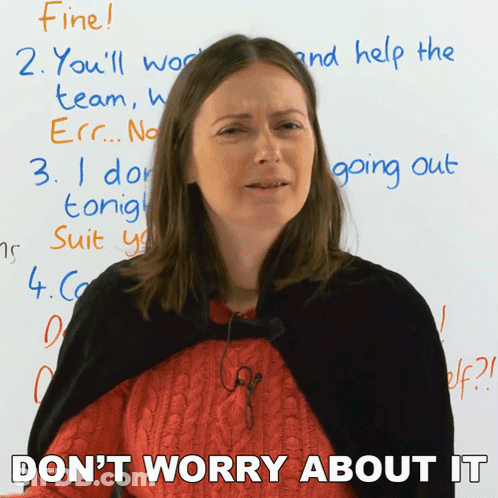 A Woman Is Standing In Front Of A White Board And Says " Don T Worry About It " GIF
