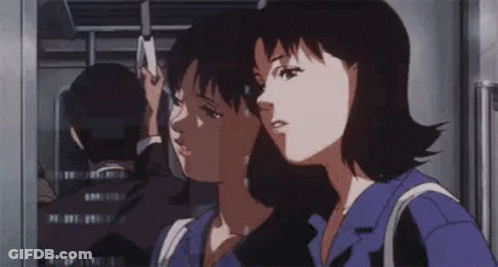 A Woman Is Standing In Front Of A Window Looking At A Man In A Mirror . GIF