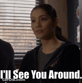 A Woman Is Standing In Front Of A Window With Blinds And Says I 'Ll See You Around . GIF